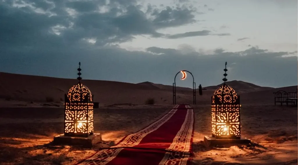 lanterns on a red carpet in merzouga desert
